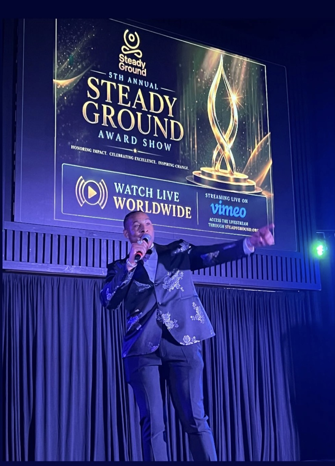 Prince El speaking on stage at the fifth annual Steady Ground Awards Show